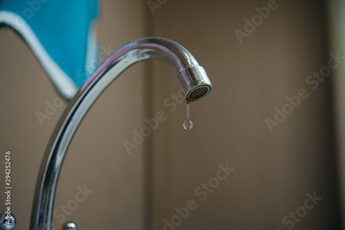 water leakage from a broken tap in the kitchen or bathroom. utility bills. ecological problem