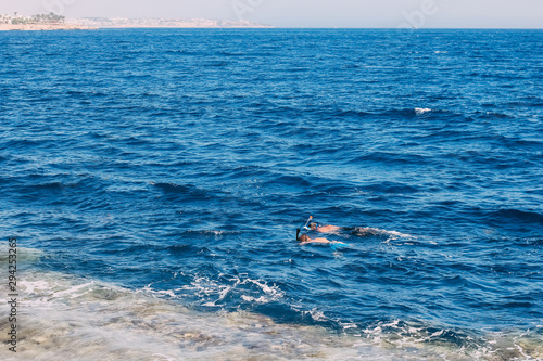 Scuba diving in the tropical sea, diving with masks