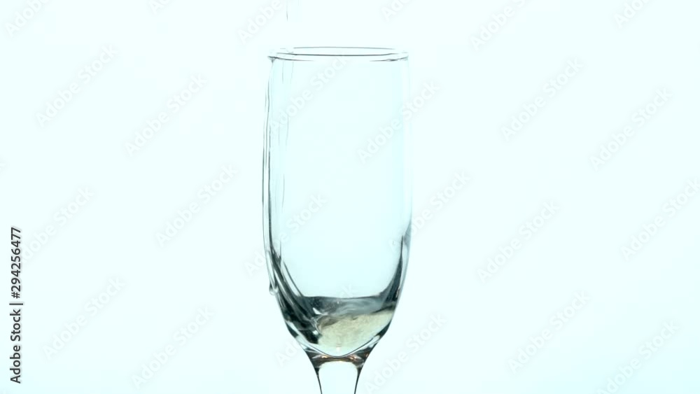 Champagne Glass Closeup - Slow motion filling of glass. Champagne Glass Closeup - Slow motion filling of glass.