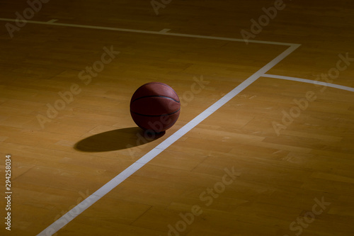 Basketball On Hardwood Court Floor With Spot Lighting © Augustas Cetkauskas