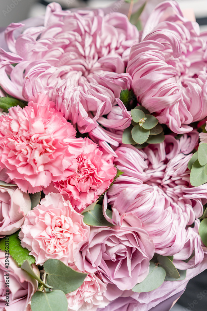 Closeup mixed flowers in bouquet. the work of the florist at a flower shop. Delicate Pastel color. Fresh cut flower. Pink color Closeup mixed flowers in bouquet. the work of the florist at a flower shop. Delicate Pastel color. Fresh cut flower. Pink color