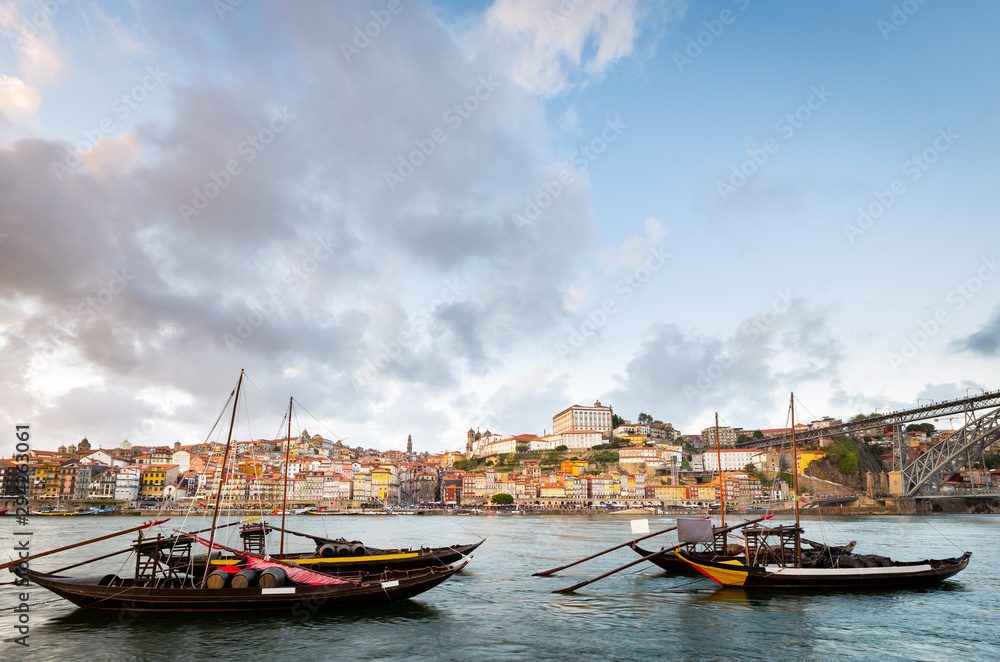 City of Porto as seen from across the Douro River with historical boats (Rabelos)