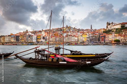 City of Porto as seen from across the Douro River with historical boats (Rabelos)