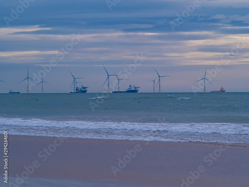 Aberdeen / Szkocja - 6 października 2019: Statki i farma wiatrowa przy brzegu Aberdeen photo