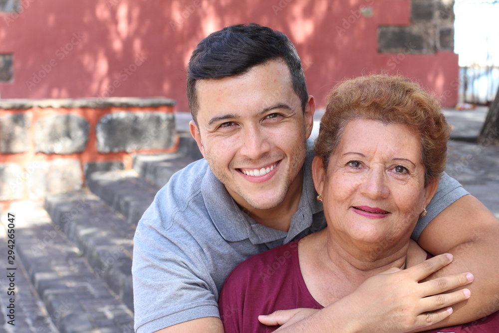 Fototapeta premium Mother and son smiling outdoors