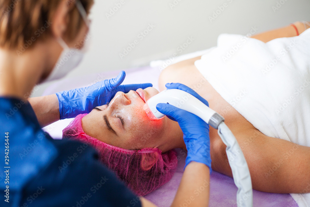 Woman getting LPG hardware massage at the beauty clinic. Professional beautician working. Woman getting LPG hardware massage at the beauty clinic. Professional beautician working.