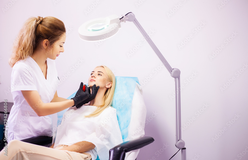 Lip Augmentation In Cosmetology Clinic. Beautiful Woman Getting Beauty Injection For Lips Lip Augmentation In Cosmetology Clinic. Beautiful Woman Getting Beauty Injection For Lips