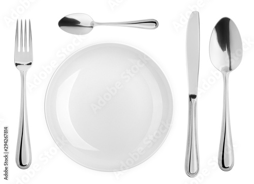 Empty plate, Spoon, teaspoon, fork, knife, cutlery isolated on white background, clipping path, top view photo