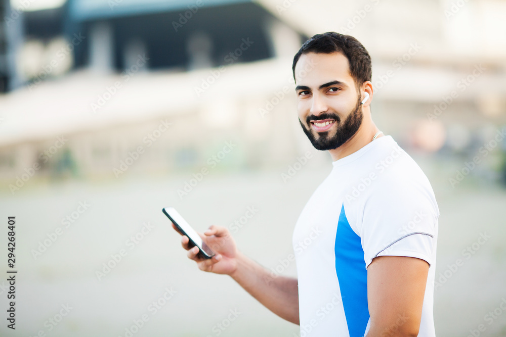 Fitness. Young man running in urban environment Fitness. Young man running in urban environment