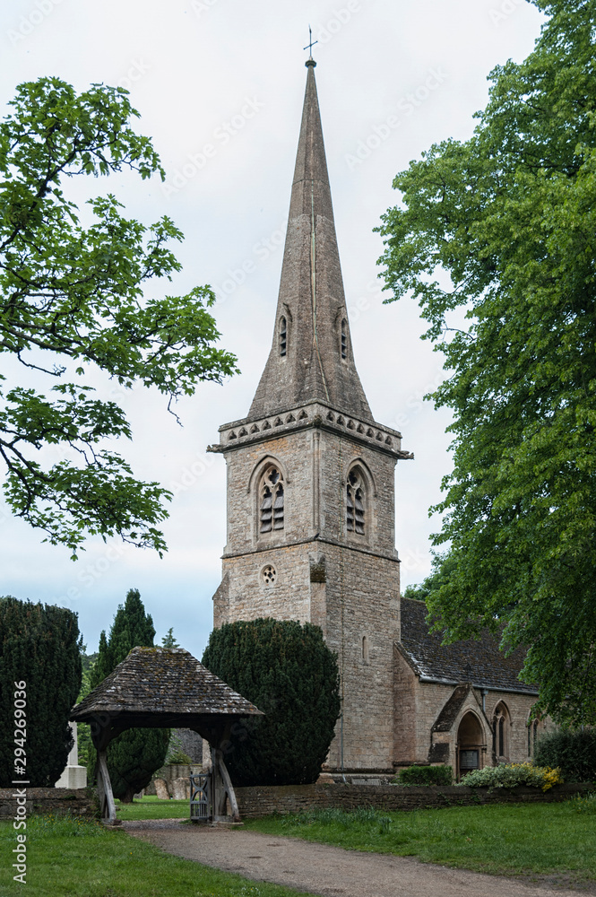 LOWER SLAUGHTER, COTSWOLDS, GLOUCESTERSHIRE, ENGLAND - MAY, 27 2018: Mary's Church with graveyard in the village of Lower Slaughter, Cotswolds, Gloucestershire, England, UK LOWER SLAUGHTER, COTSWOLDS, GLOUCESTERSHIRE, ENGLAND - MAY, 27 2018: Mary's Church with graveyard in the village of Lower Slaughter, Cotswolds, Gloucestershire, England, UK