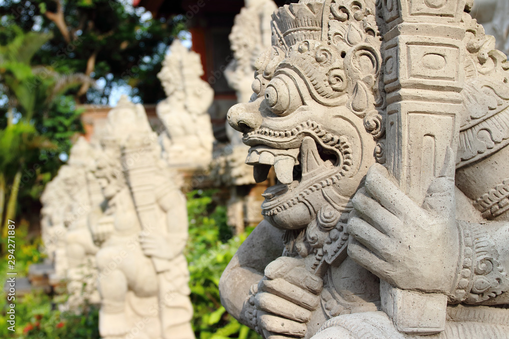 Detail of statues and sculptures placed in the garden outside Ubud Palace Puri Saren Agung, home of the Ubud royal family and one of the most visited spots of the whole city.