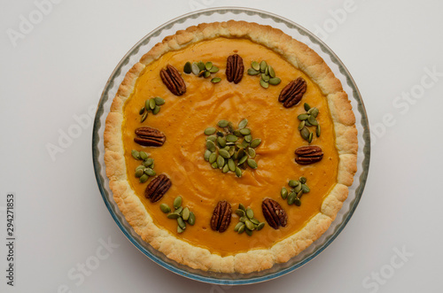 Tasty pumpkin pie, tart made for Thanksgiving day in a baking dish