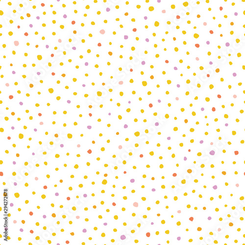 Seamless vector hand drawn dot pattern with hand painted irregular yellow and pink dot in wavy movement. Graphic and modern design for scrapbooking, stationary, fashion and packaging design.
