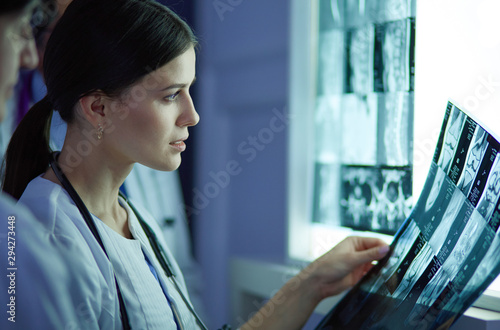 Hospital doctors looking at x-rays in an emergency room