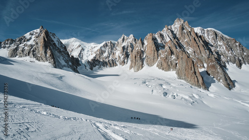 View of the Mont Maudit, Mont Blanc du Tacul and in the distance the Mont Blanc summit with in the foreground the massive glacier