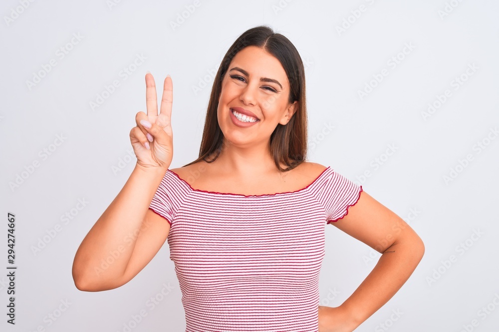 Portrait of beautiful young woman standing over isolated white background showing and pointing up with fingers number two while smiling confident and happy. Portrait of beautiful young woman standing over isolated white background showing and pointing up with fingers number two while smiling confident and happy.