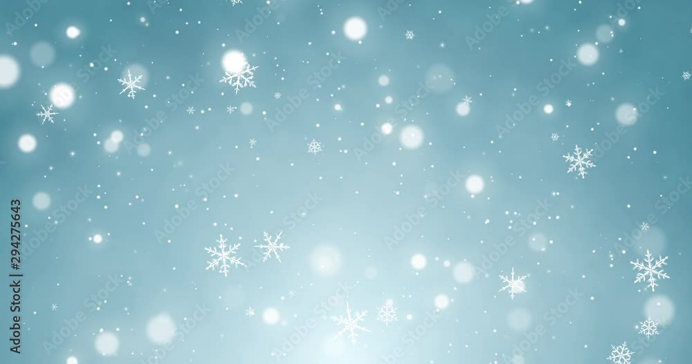 White confetti, snowflakes and bokeh lights on the blue Christmas background. White confetti, snowflakes and bokeh lights on the blue Christmas background.