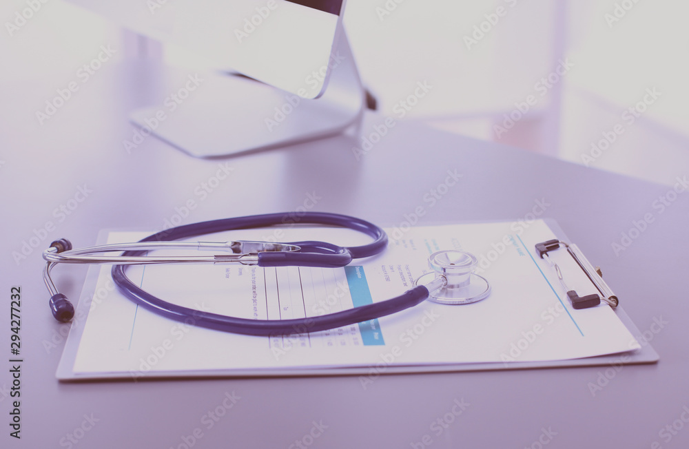 Medical equipment: blue stethoscope and tablet on white background. Medical equipment Medical equipment: blue stethoscope and tablet on white background. Medical equipment