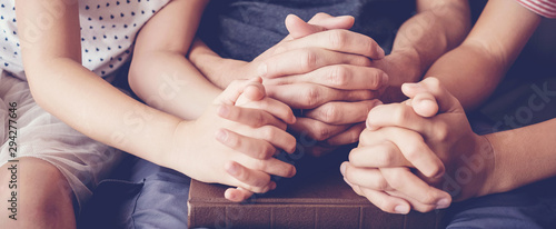 Bild auf Leinwand children praying with parent at home, family worship online together, home churc