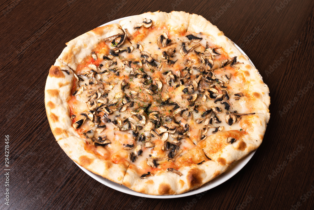 Bad, cheap pizza with mushrooms and cheese. Bad, cheap pizza with mushrooms and cheese.