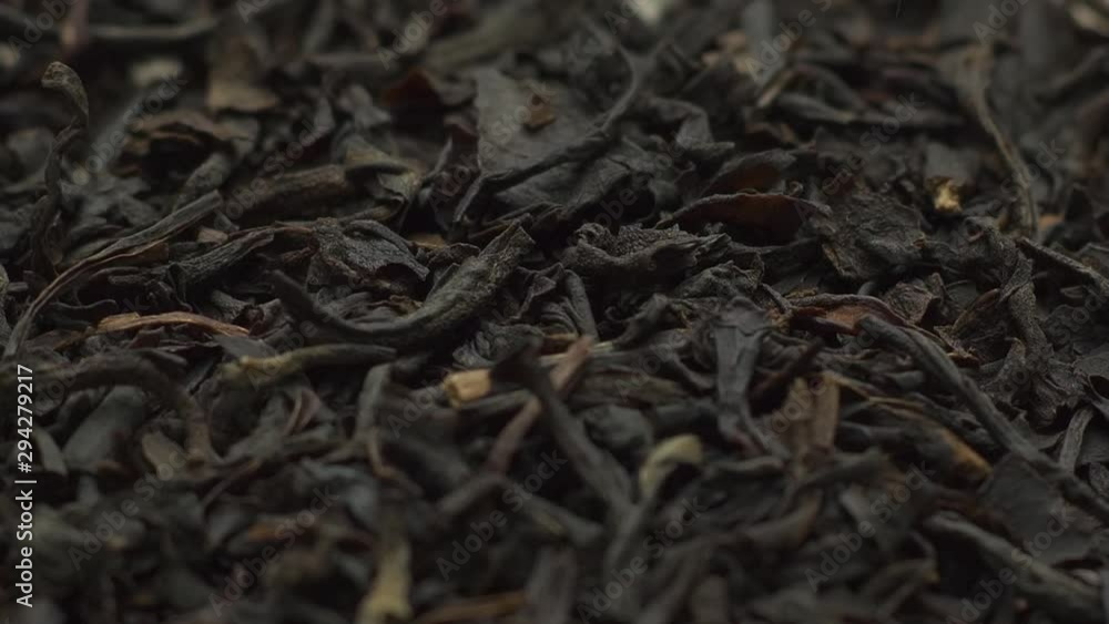 Black tea falls on the wooden board Black tea falls on the wooden board
