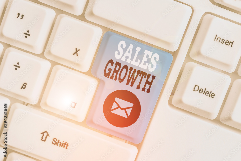 Conceptual hand writing showing Sales Growth. Concept meaning ability to increase revenue over a fixed period of time White pc keyboard with note paper above the white background Conceptual hand writing showing Sales Growth. Concept meaning ability to increase revenue over a fixed period of time White pc keyboard with note paper above the white background