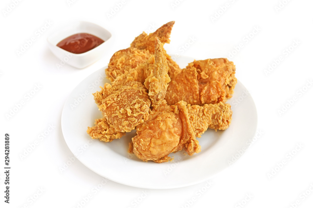 Delicious crispy fried chicken with tomato sauce on white plate Delicious crispy fried chicken with tomato sauce on white plate