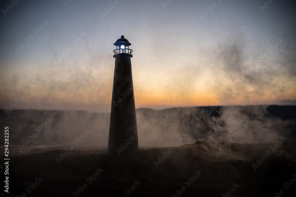 Beautiful sunset landscape with an old lighthouse