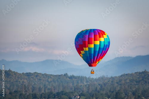 Colorful hot air balloon over Grants Pass Oregon on a beautiful summer morning © just.b photography