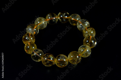 yellow Citrine Beads bracelet with black background