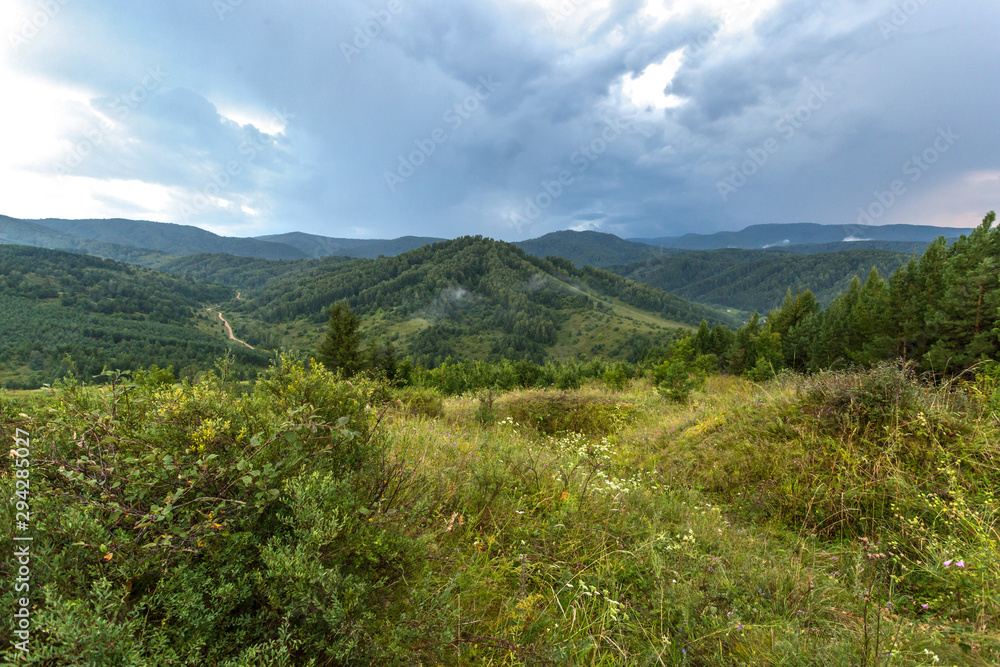 Naklejka premium landscape with mountains and clouds