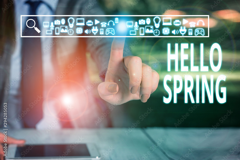 Writing note showing Hello Spring. Business concept for welcoming the season of the blossoming of flowers End of winter Woman wear formal work suit presenting presentation using smart device Writing note showing Hello Spring. Business concept for welcoming the season of the blossoming of flowers End of winter Woman wear formal work suit presenting presentation using smart device
