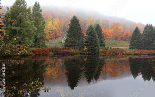 Perfect autumn reflections in rural Quebec, Canada