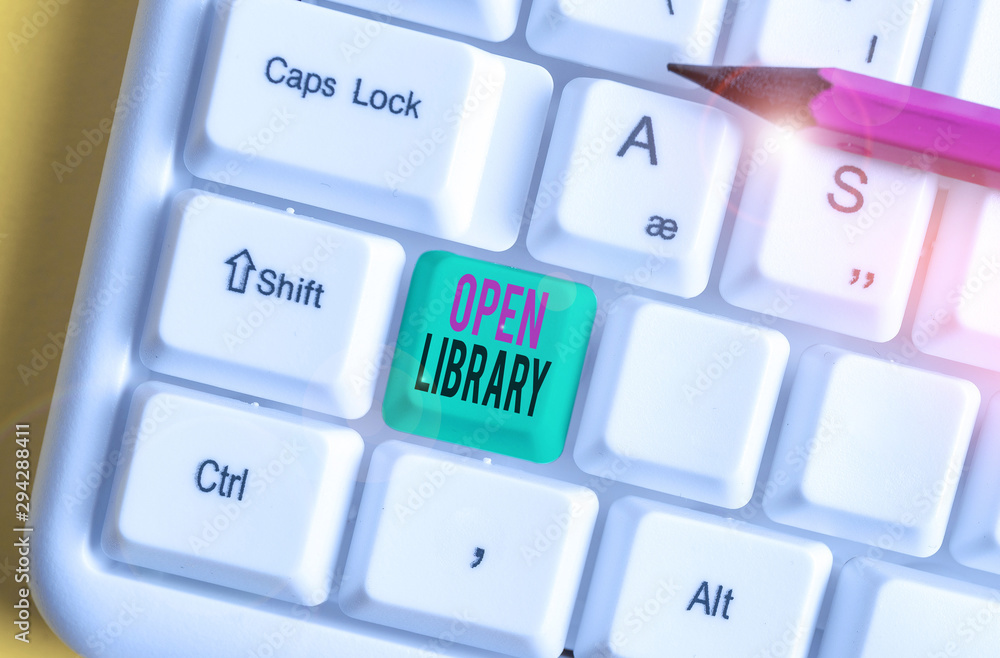 Text sign showing Open Library. Business photo showcasing online access to analysisy public domain and outofprint books White pc keyboard with empty note paper above white background key copy space Text sign showing Open Library. Business photo showcasing online access to analysisy public domain and outofprint books White pc keyboard with empty note paper above white background key copy space