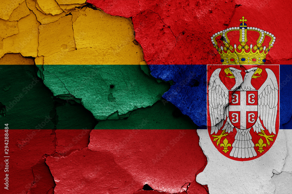 flags of Lithuania and Serbia painted on cracked wall
