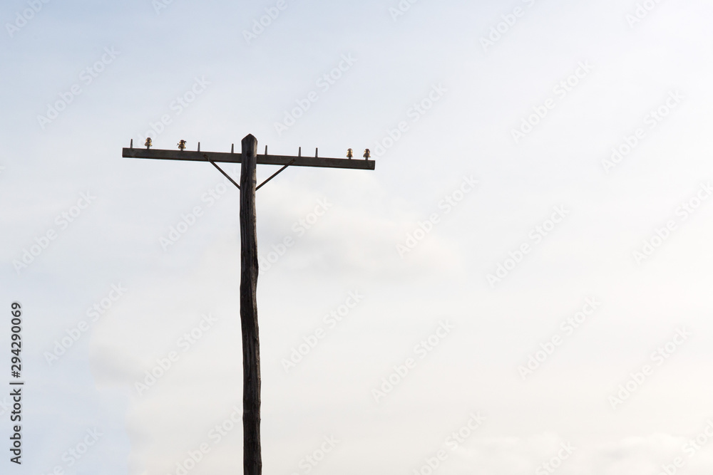 railroad telegraph pole without wires on a light sky railroad telegraph pole without wires on a light sky