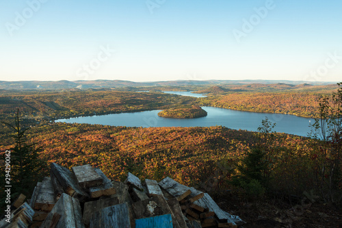Autumn scene: lakes, mountains and forest in colorful fall season viewd from Adstock Mount, Qc. Canada