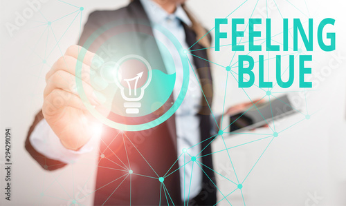 Photography Conceptual hand writing showing Feeling Blue