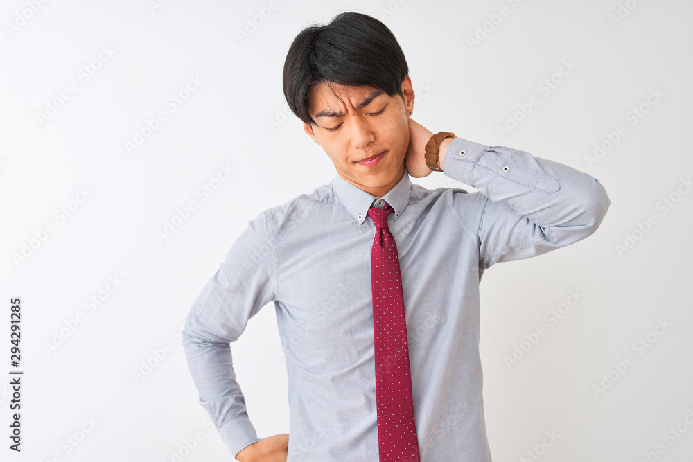 Chinese businessman wearing elegant tie standing over isolated white background Suffering of neck ache injury, touching neck with hand, muscular pain Chinese businessman wearing elegant tie standing over isolated white background Suffering of neck ache injury, touching neck with hand, muscular pain