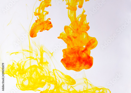 Food color drop and dissolve in water for background and texture concept.