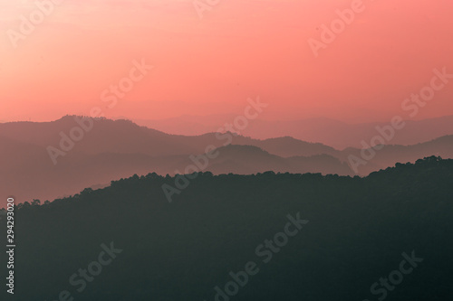 The blurred natural background of colorful twilight in the evening  on the high mountains  with many forests  provide fresh air and preserve the ecology.