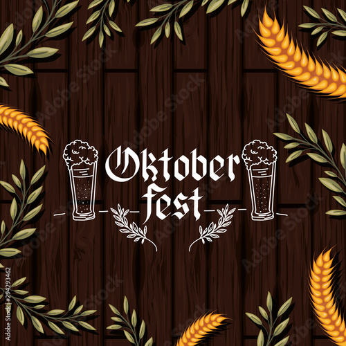 oktoberfest lettering with wreath leafs in wooden background