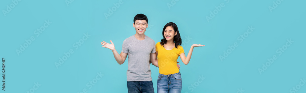 Couple holding each other and smiling with open hand gesture Couple holding each other and smiling with open hand gesture
