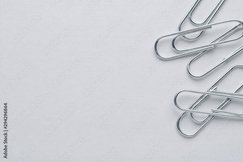 Metal paper clips on white background with copy space Metal paper clips on white background with copy space