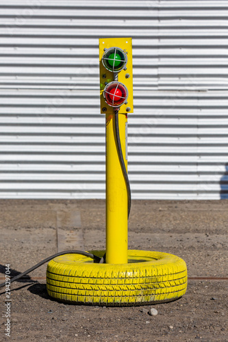 Old tire painted and reused for a stop and go light at a certified truck scale in downtown George, Washington photo