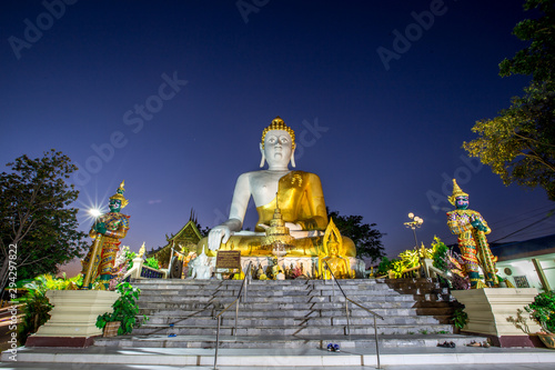 Wat Phra That Doi Kham-Chiang Mai: 17 September 2019, a group of tourists come to see the scenery and make merit on the way inside the temple on the foot of a mountain, Mae Hia, Thailand. © bangprik
