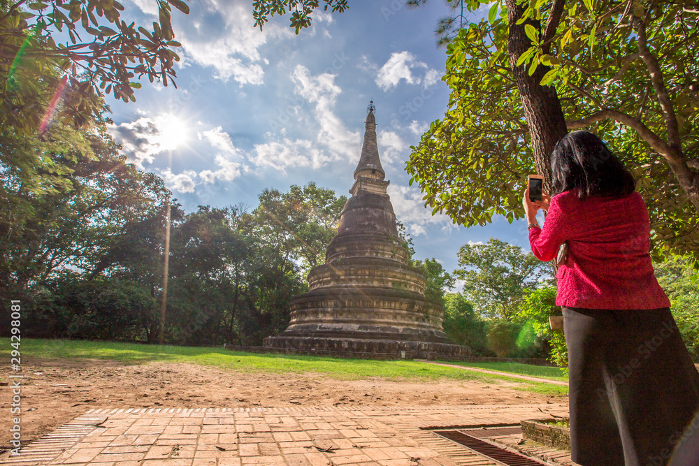 Natural background, large old pagoda (Wat Umong Suan Phutthatham), in Chiang Mai, is a famous tourist destination, tourists are always popular to make merit and see the beauty according to the seasons