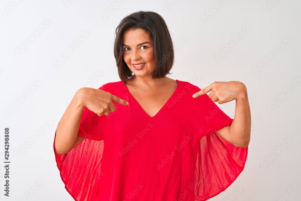 Young beautiful woman wearing red t-shirt standing over isolated white background looking confident with smile on face, pointing oneself with fingers proud and happy.