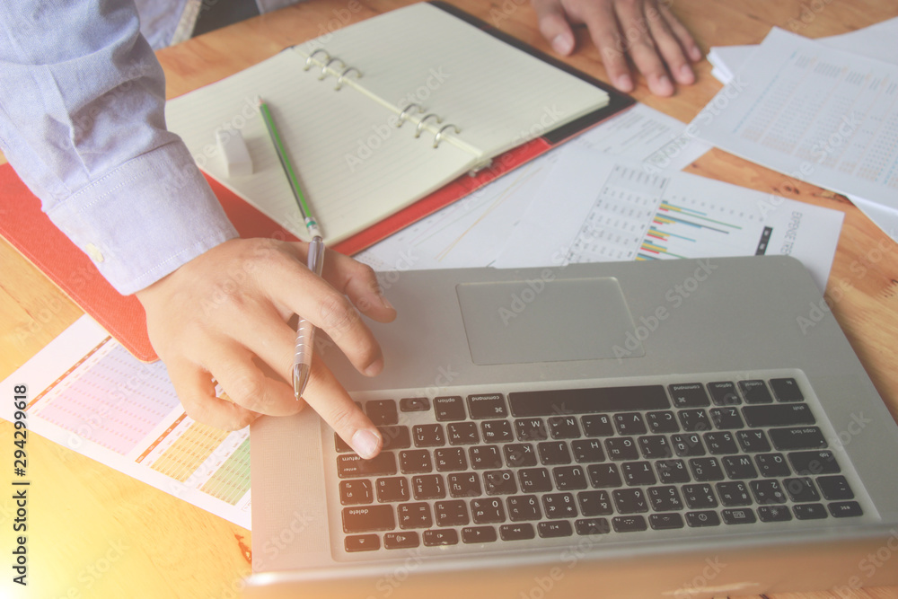 businessman working use laptop in office for discussing documents and ideas , with soft focus, vintage tone businessman working use laptop in office for discussing documents and ideas , with soft focus, vintage tone