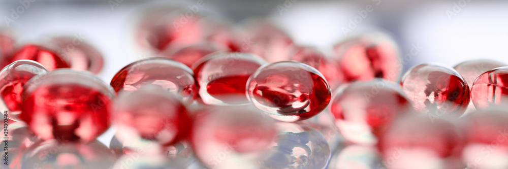 Red tablets scattered on the table of the pharmaceutical laboratory pill for the prescription and treatment of various diseases chemistry - obrazy, fototapety, plakaty 